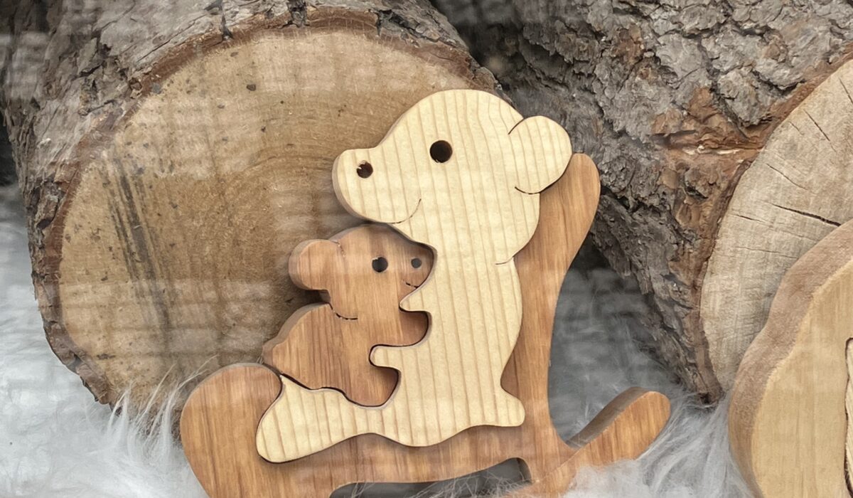 wooden childrens jigsaw of a bear and cub hugging